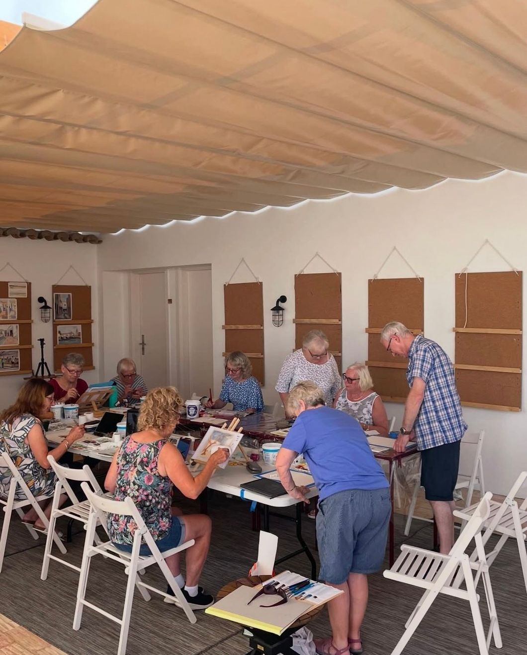 A group of people are sitting around a table in a room