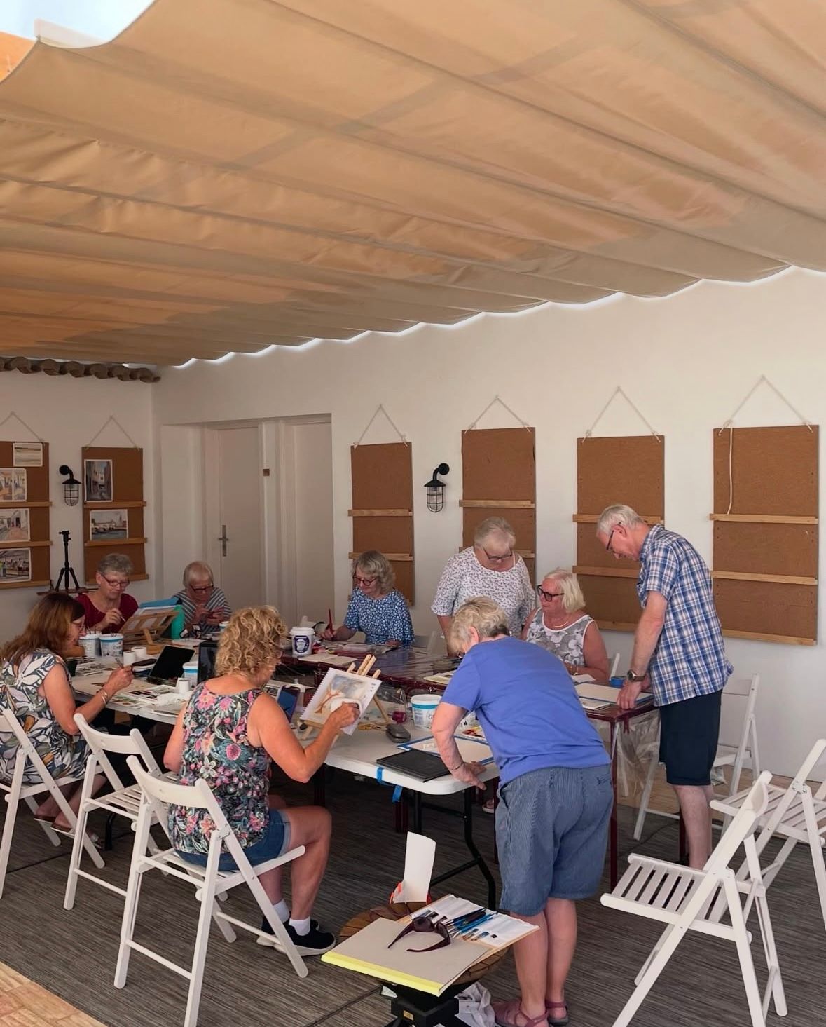 A group of people are sitting around a table in a room