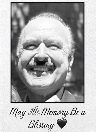 Black and white portrait of a smiling man with a mustache. Text below reads 