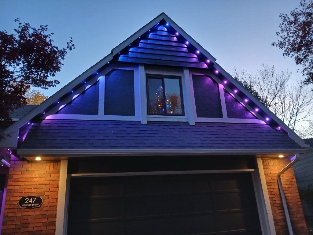 A house with purple and blue lights on the roof