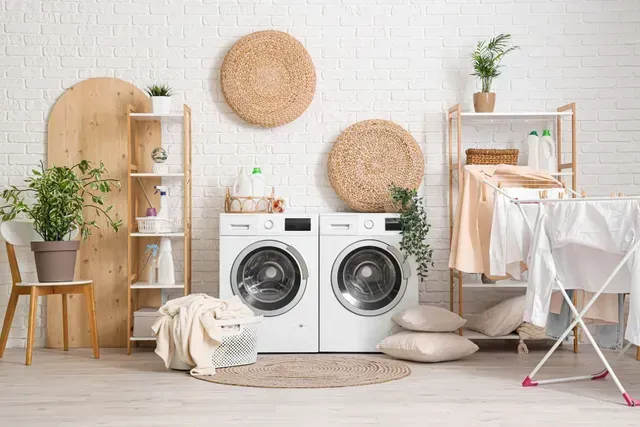 A Laundry Room with Two White Washing Machines — Central Coast Washing Machines & Refrigerator Repairs in San Remo, NSW