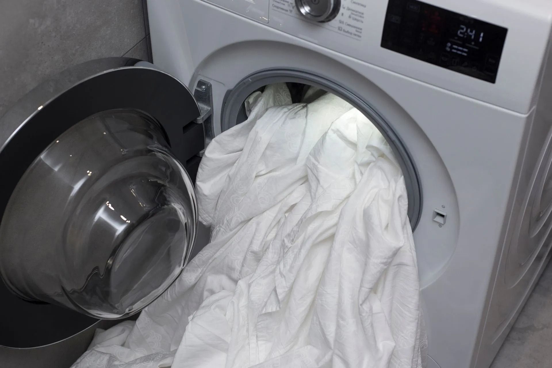 A Front-loading White Washing Machine — Central Coast Washing Machines & Refrigerator Repairs in San Remo, NSW