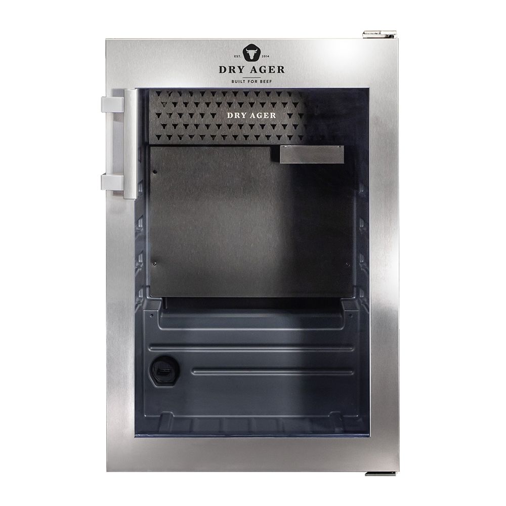 Frigorífico para maduración de carnes Dry Ager de acero inoxidable con puerta de cristal abierta, interior visible.
