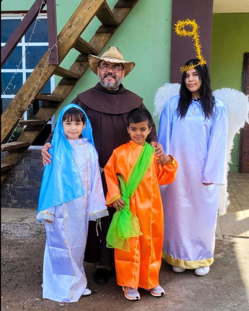 A group of people dressed in costumes standing next to each other