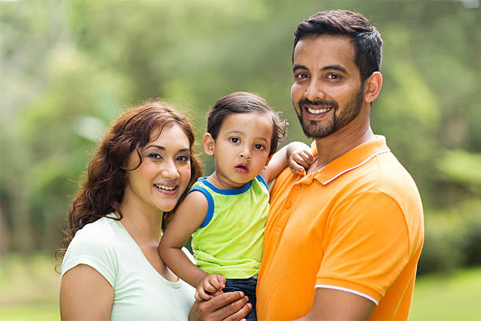 Smiling parents with child