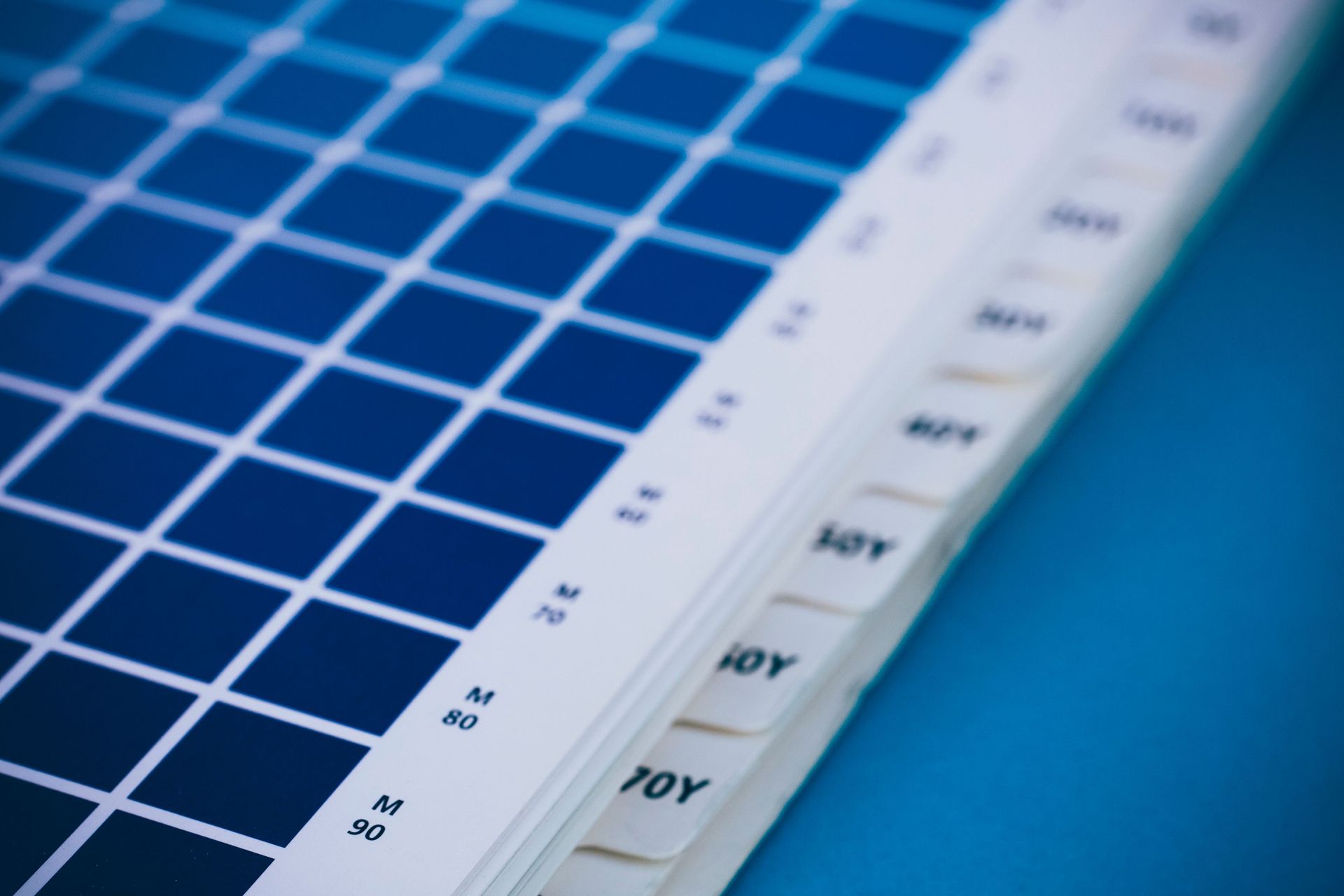 Blue solar panel with white grid lines and measurement scale