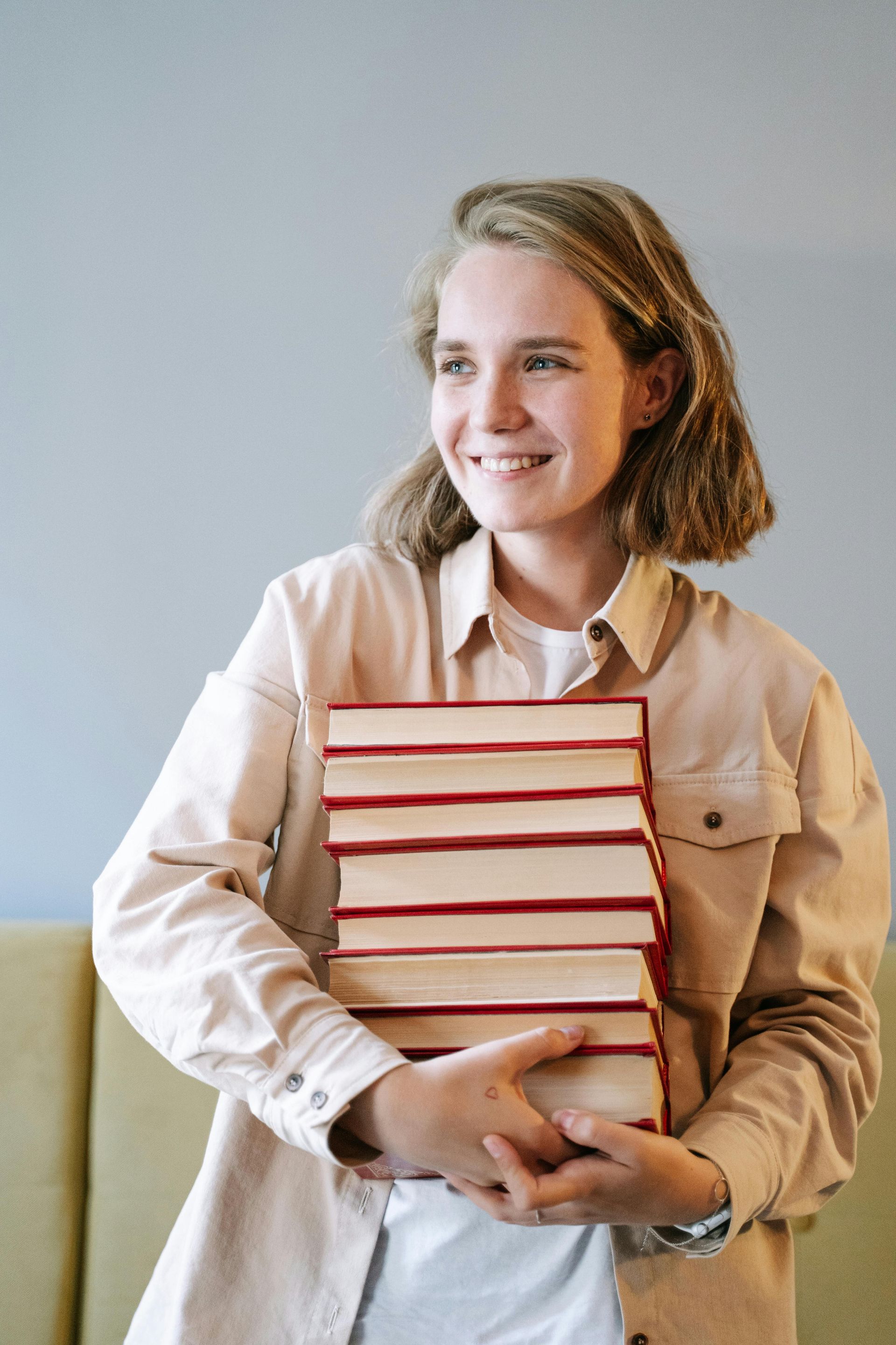 A pair of glasses is sitting on top of a $ 100 startup book.