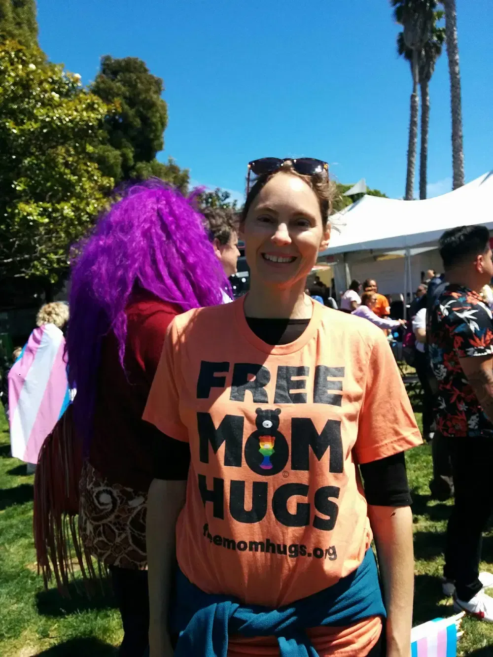 Alison at SF Pride wearing a Free Mom Hugs t-shirt