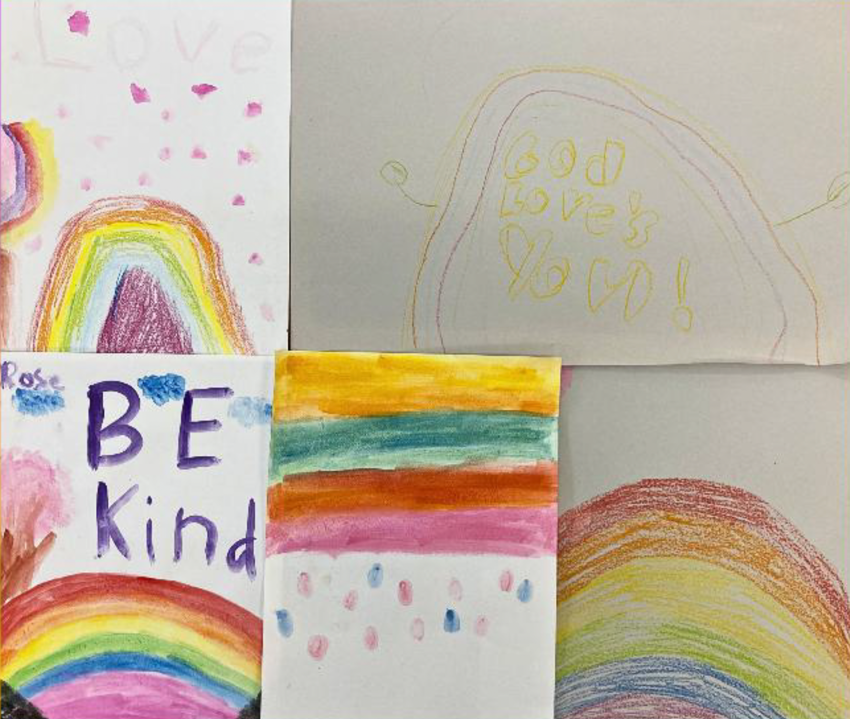 A mosaic of child-drawn titles that say “be kind” and have rainbows on them