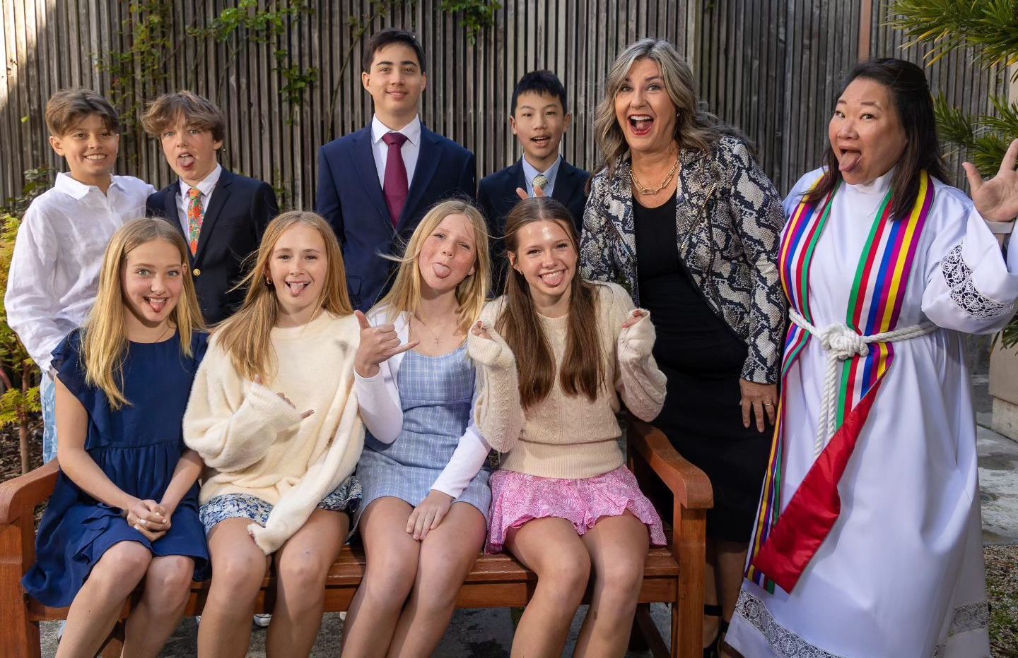 Confirmation class of 2023 making silly faces in the garden