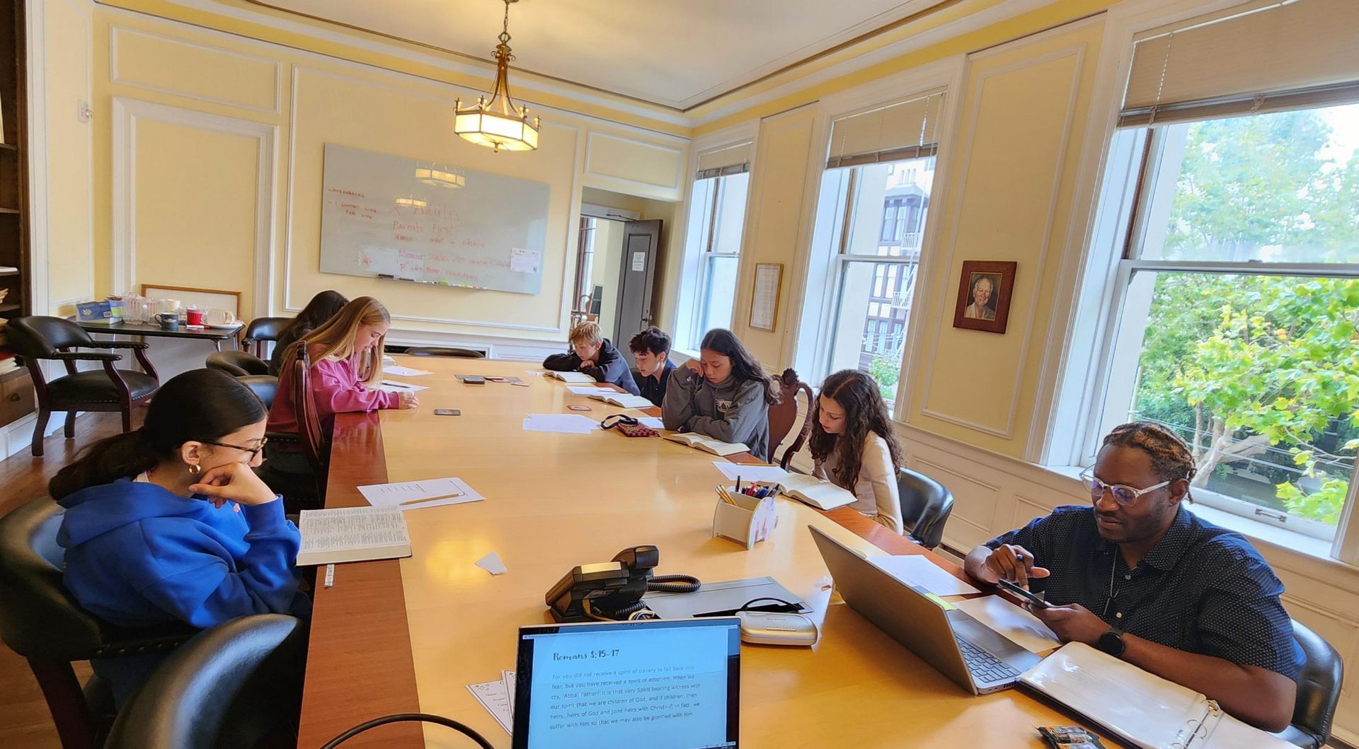 The Youth confirmation class in the Gilchrist room. They are studying out of the Bible