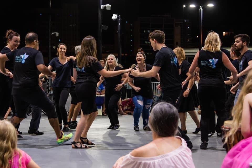 A Group Of People Are Dancing Together On A Stage — Global Dance Collective In West End, QLD