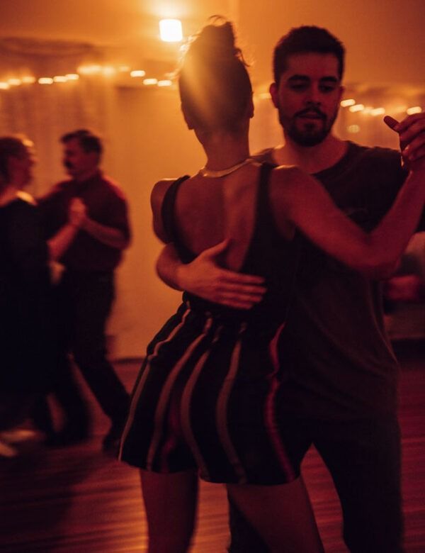 A Man And A Woman Are Dancing Tango In A Dark Room — Global Dance Collective In West End, QLD
