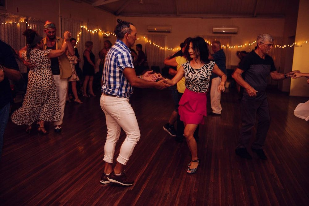 A Group Of People Are Dancing In A Room — Global Dance Collective In West End, QLD