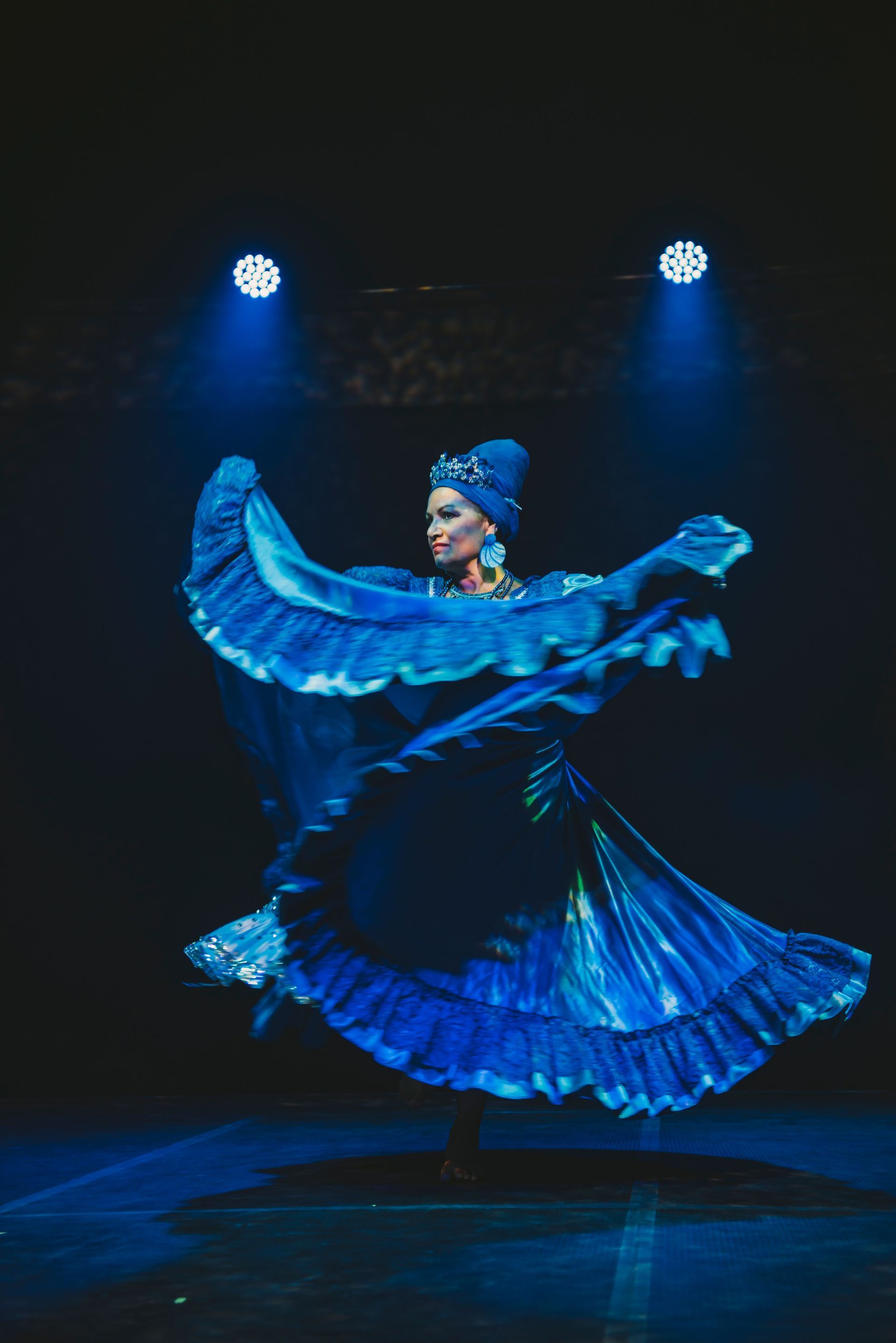 A Woman Is Dancing In A Room With A Group Of People — Global Dance Collective In West End, QLD
