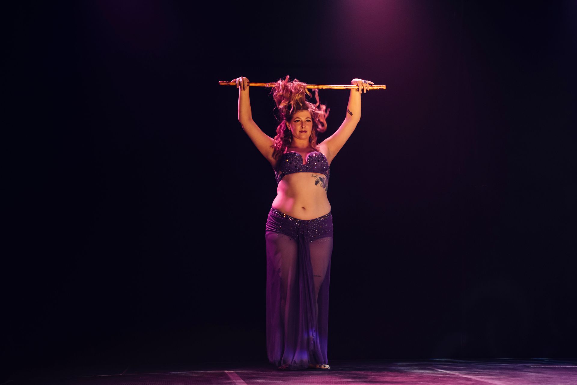 A Woman In A Gold Costume With Wings Is Dancing — Global Dance Collective In West End, QLD