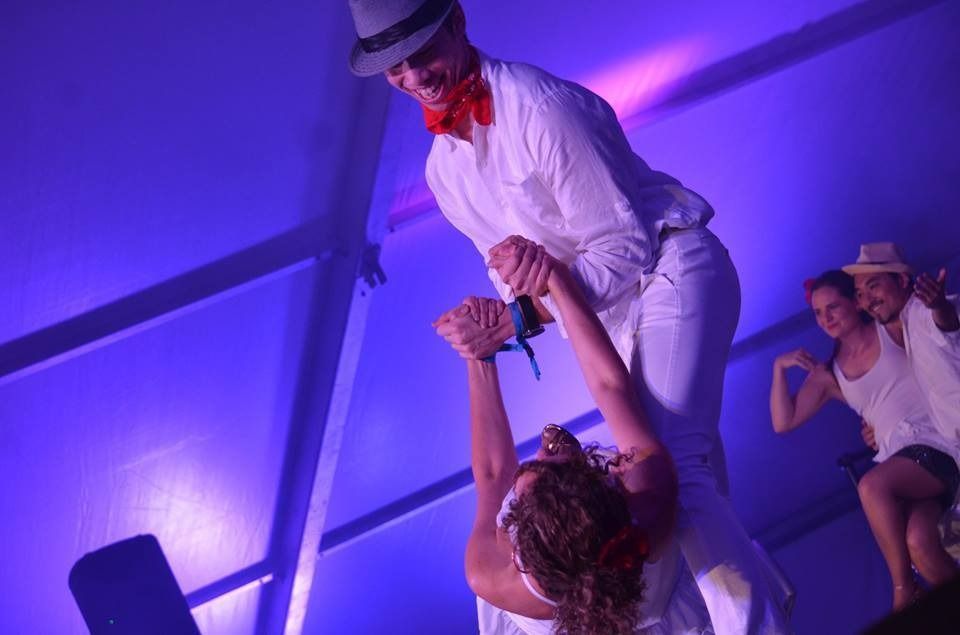 A Man And Woman Are Dancing In A Room With Purple Lights — Global Dance Collective In West End, QLD