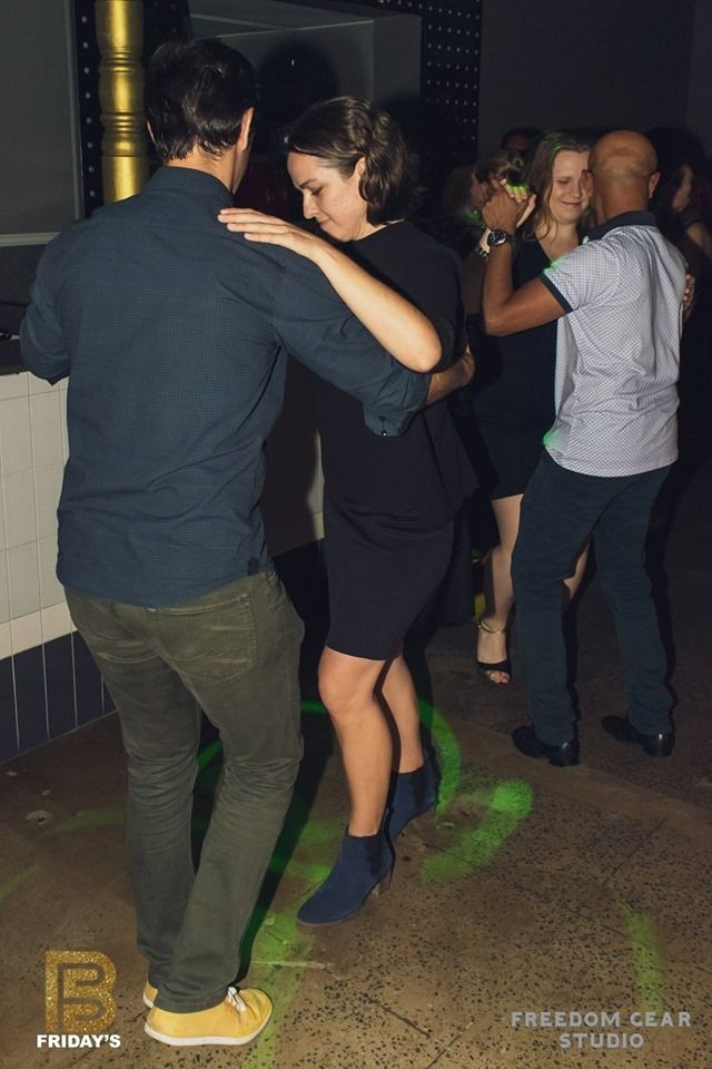 A Group Of People Are Dancing In A Dark Room — Global Dance Collective In West End, QLD