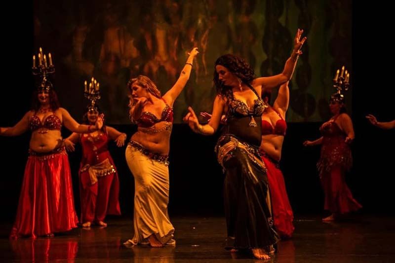A Group Of Belly Dancers Are Dancing On A Stage — Global Dance Collective In West End, QLD