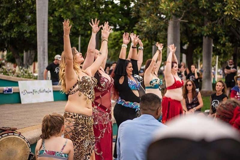 A Group Of Belly Dancers Are Performing In Front Of A Crowd — Global Dance Collective In West End, QLD