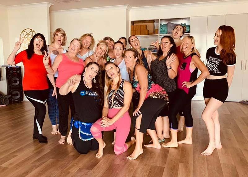 A Group Of Women Are Posing For A Picture In A Dance Studio — Global Dance Collective In West End, QLD