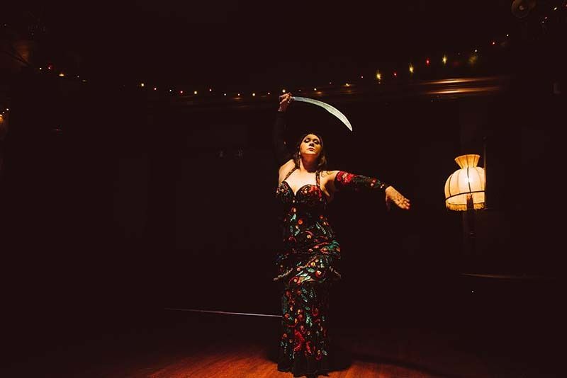 A Woman Performing A Dance While Holding A Sword — Global Dance Collective In West End, QLD