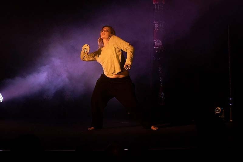 A Woman In A White Shirt And Black Pants Is Dancing On A Stage — Global Dance Collective In West End, QLD