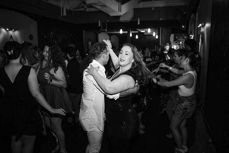 A Black And White Photo Of A Group Of People Dancing In A Club — Global Dance Collective In West End, QLD