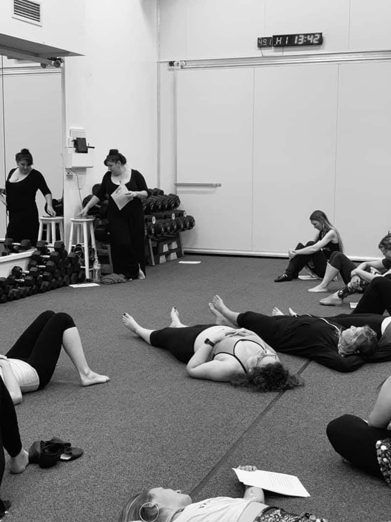 A Group Of People Are Laying On The Floor In A Gym — Global Dance Collective In West End, QLD