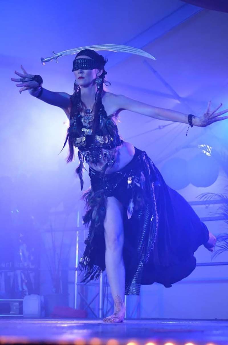 A Woman In A Belly Dancer Costume Is Dancing On A Stage — Global Dance Collective In West End, QLD