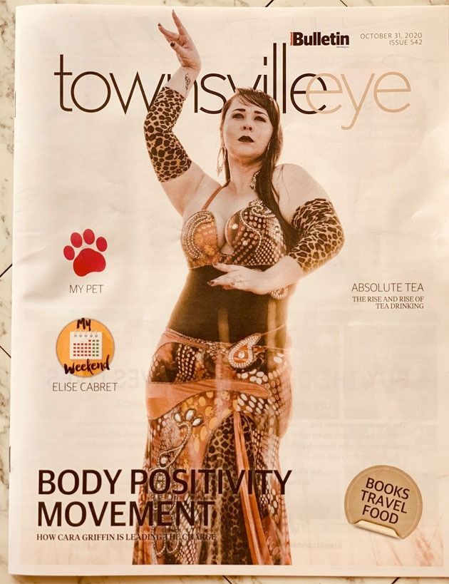A Woman In A Leopard Print Dress Is On The Cover Of A Townsville Eye Magazine — Global Dance Collective In West End, QLD
