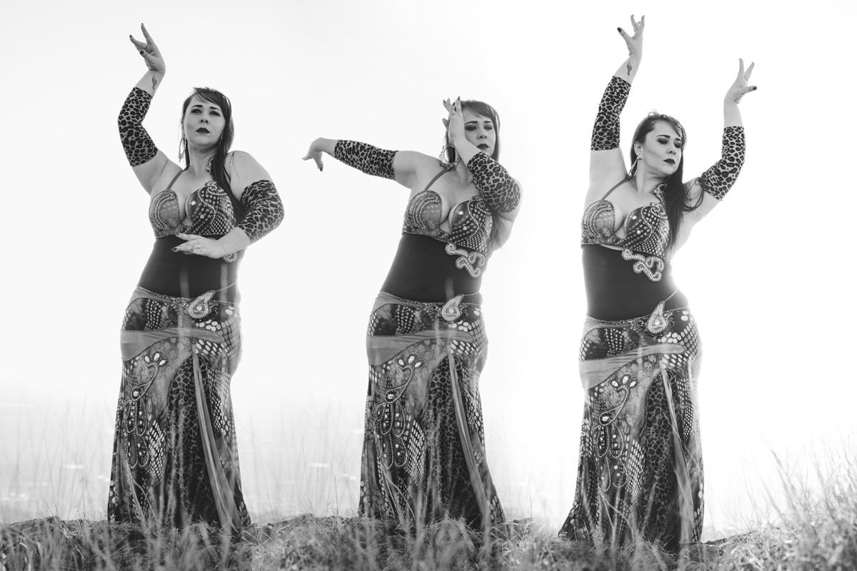 Three Belly Dancers Are Dancing In A Field In A Black And White Photo — Global Dance Collective In West End, QLD