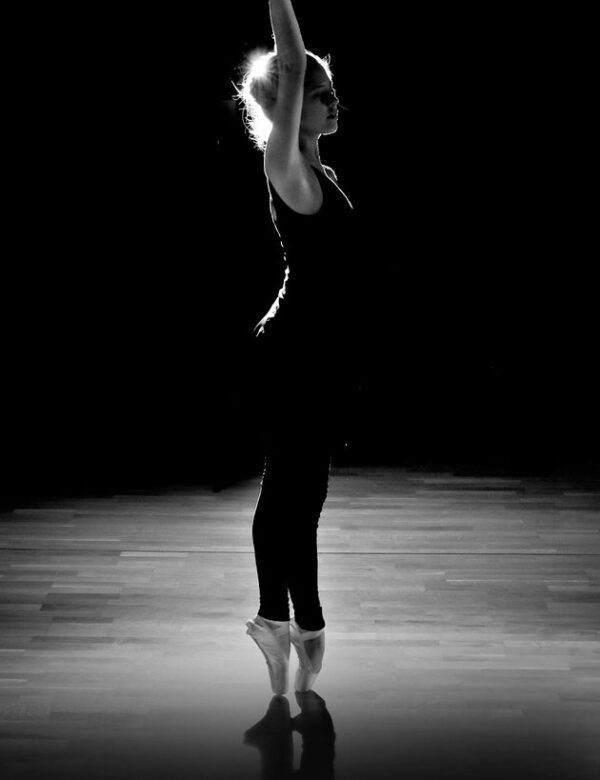 A Black And White Photo Of A Woman Dancing In A Dark Room — Global Dance Collective In West End, QLD