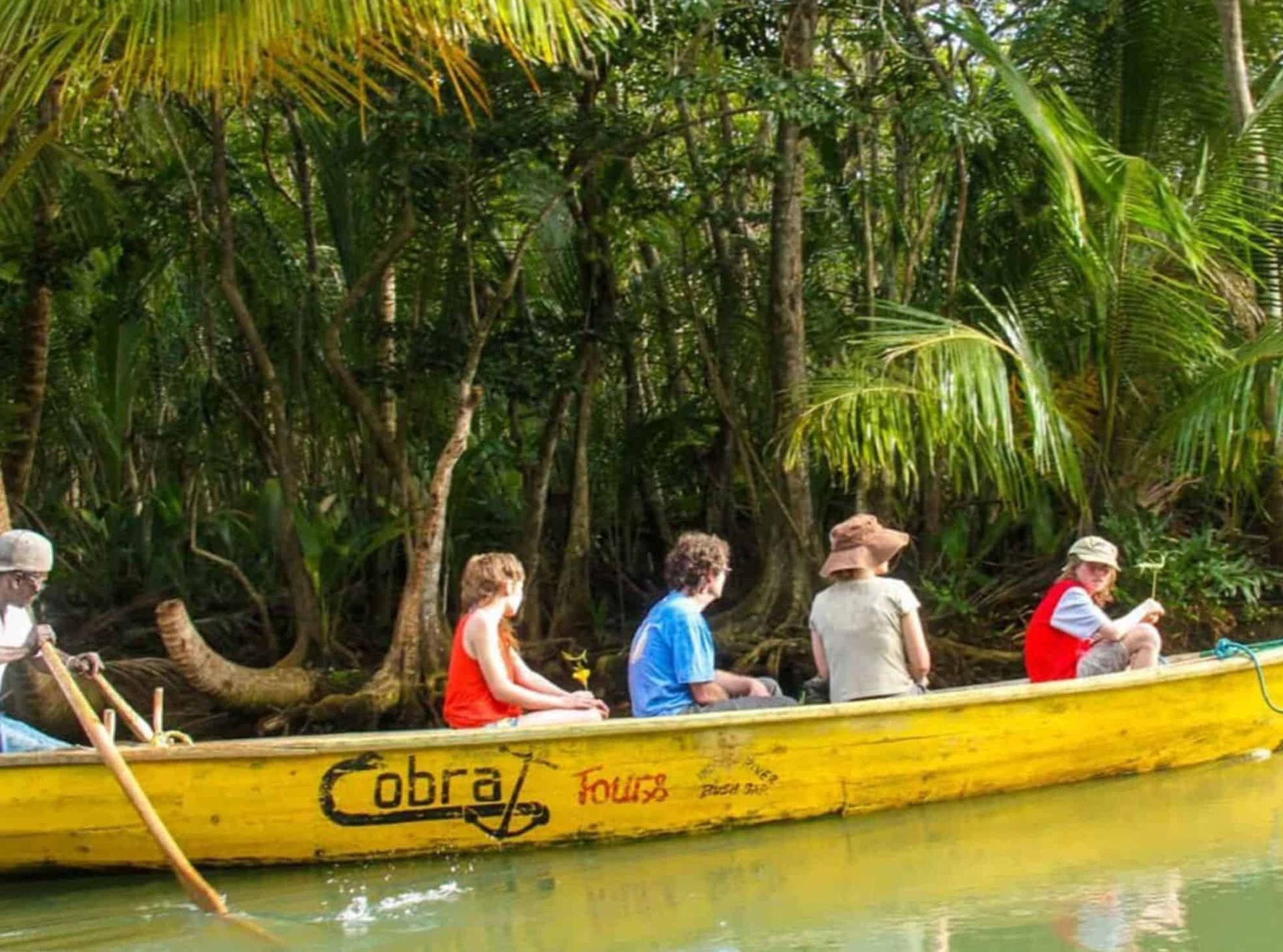 People on a yellow boat labeled 