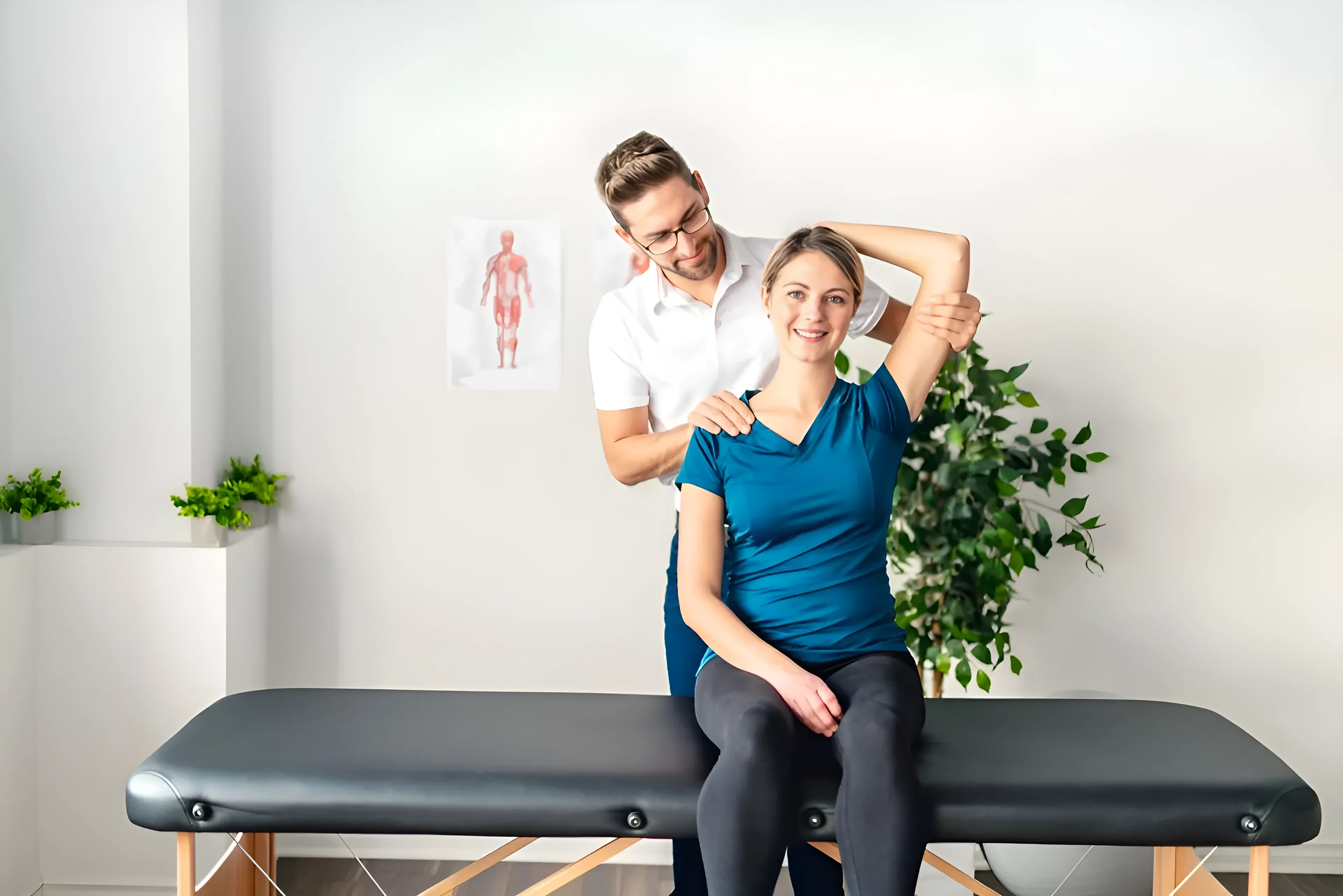 Physical Therapist Assisting a Person With a Seated Arm Stretch — Barolin Physiotherapy Services in Bundaberg South, QLD