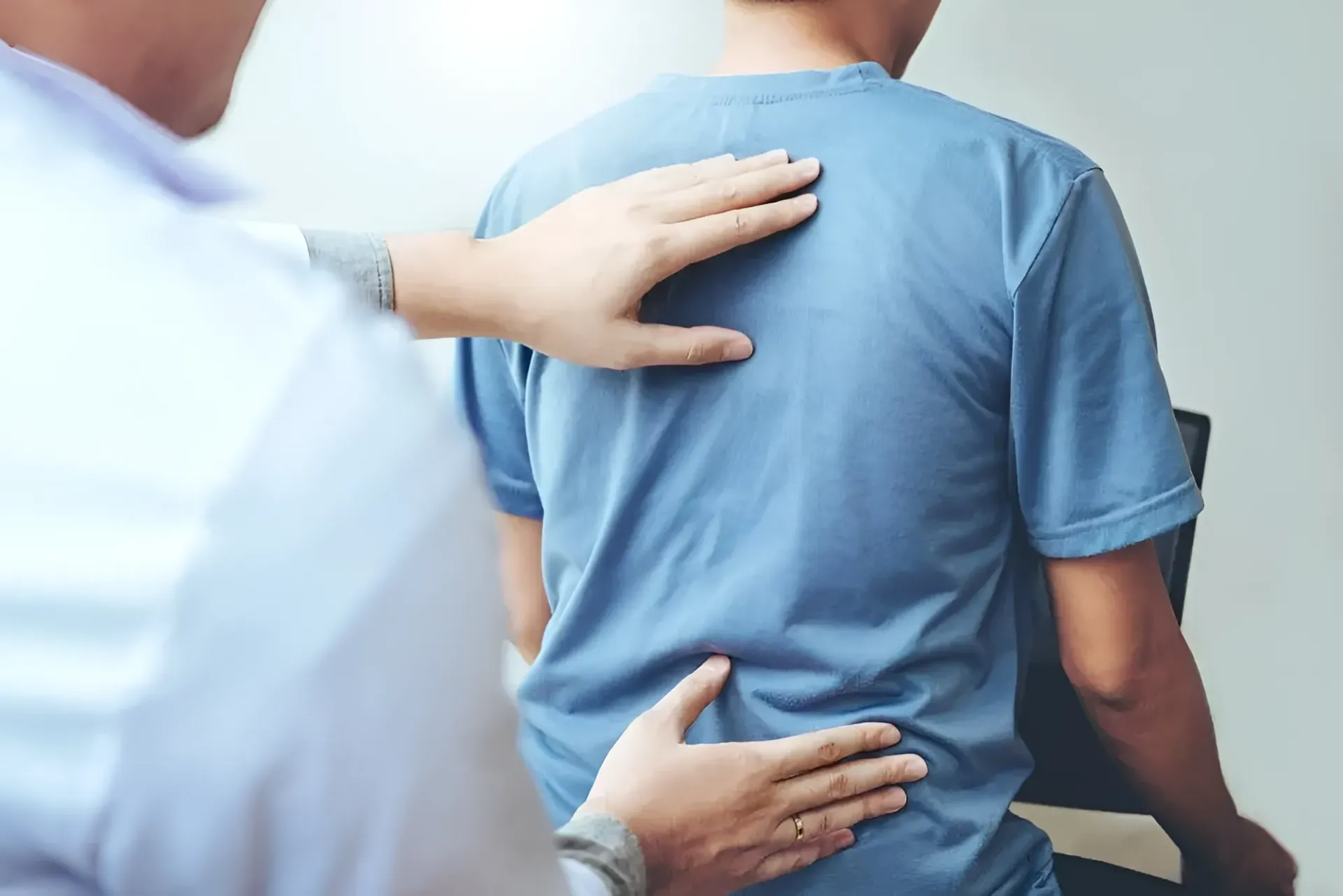 Doctor Examining a Person's Back — Barolin Physiotherapy Services in Bundaberg South, QLD