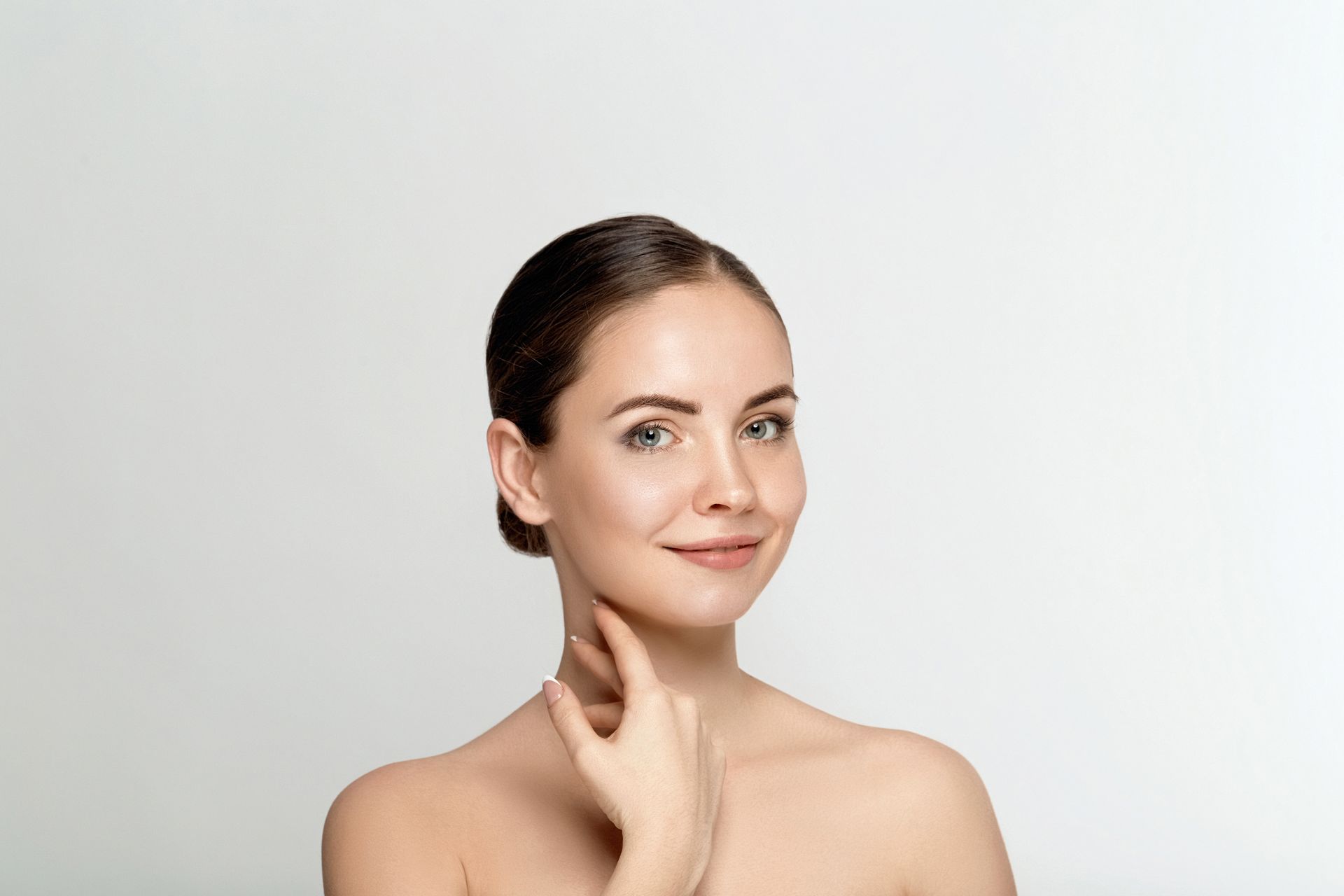 Beautiful Happy Smiling Young Woman with Fresh Natural Facial Makeup On Beauty Face.