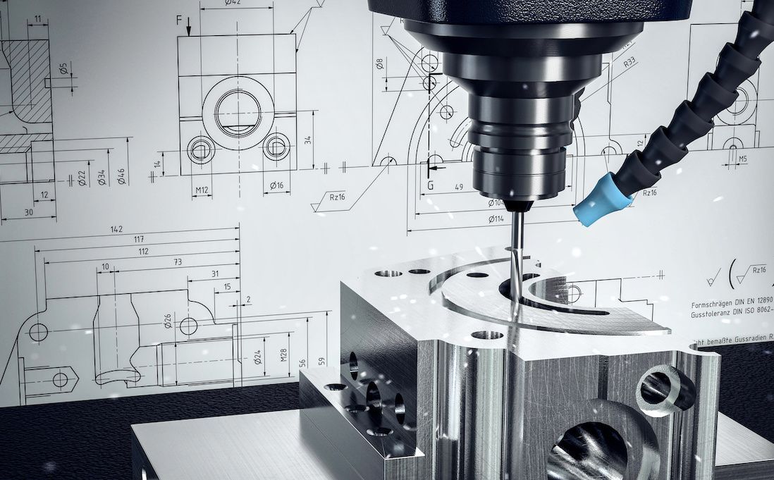 A machine is cutting a piece of metal with a drawing in the background.