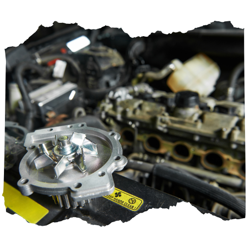 A water pump is sitting under the hood of a car.
