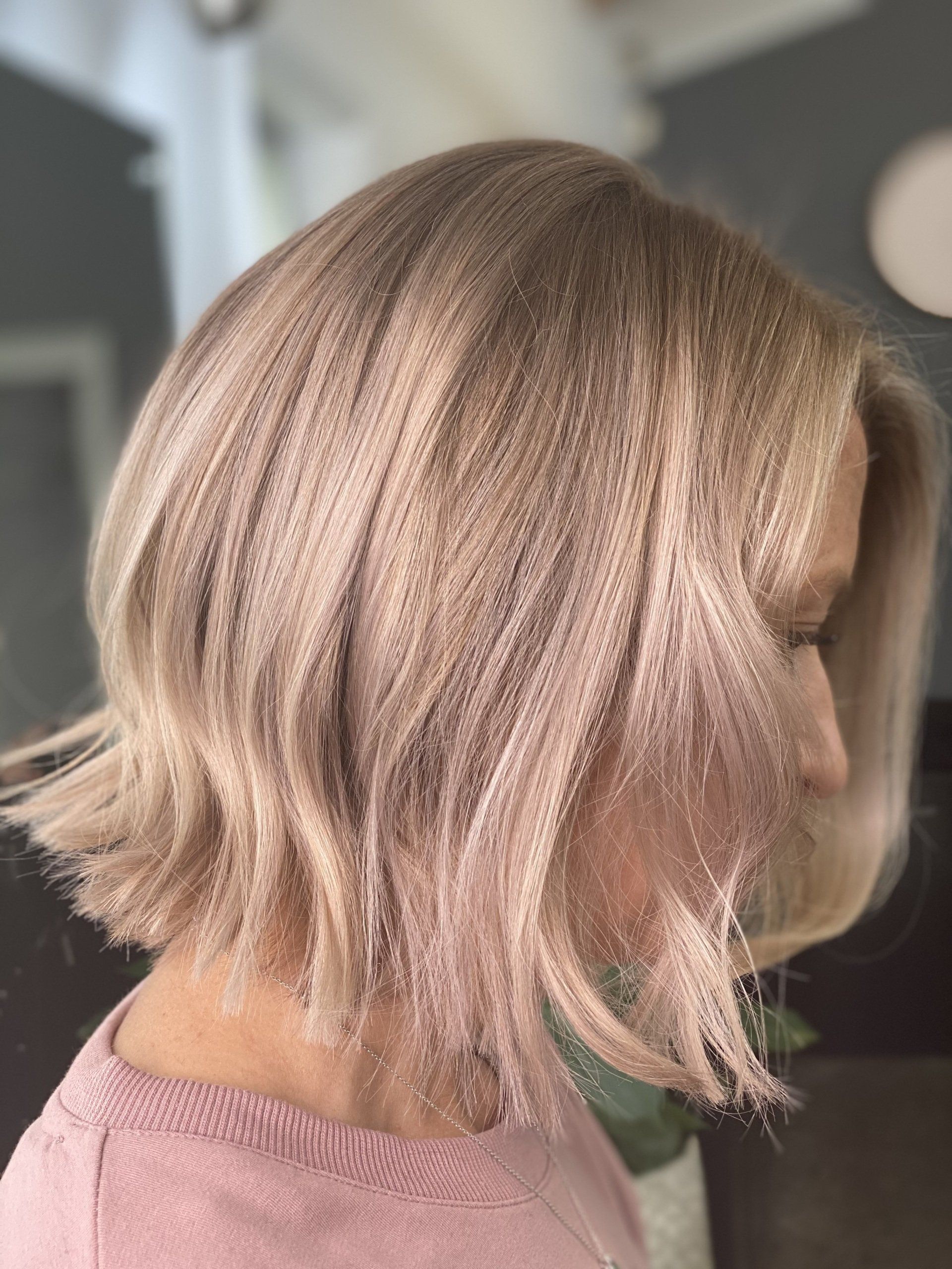 Woman with wavy, light blonde bob hairstyle.