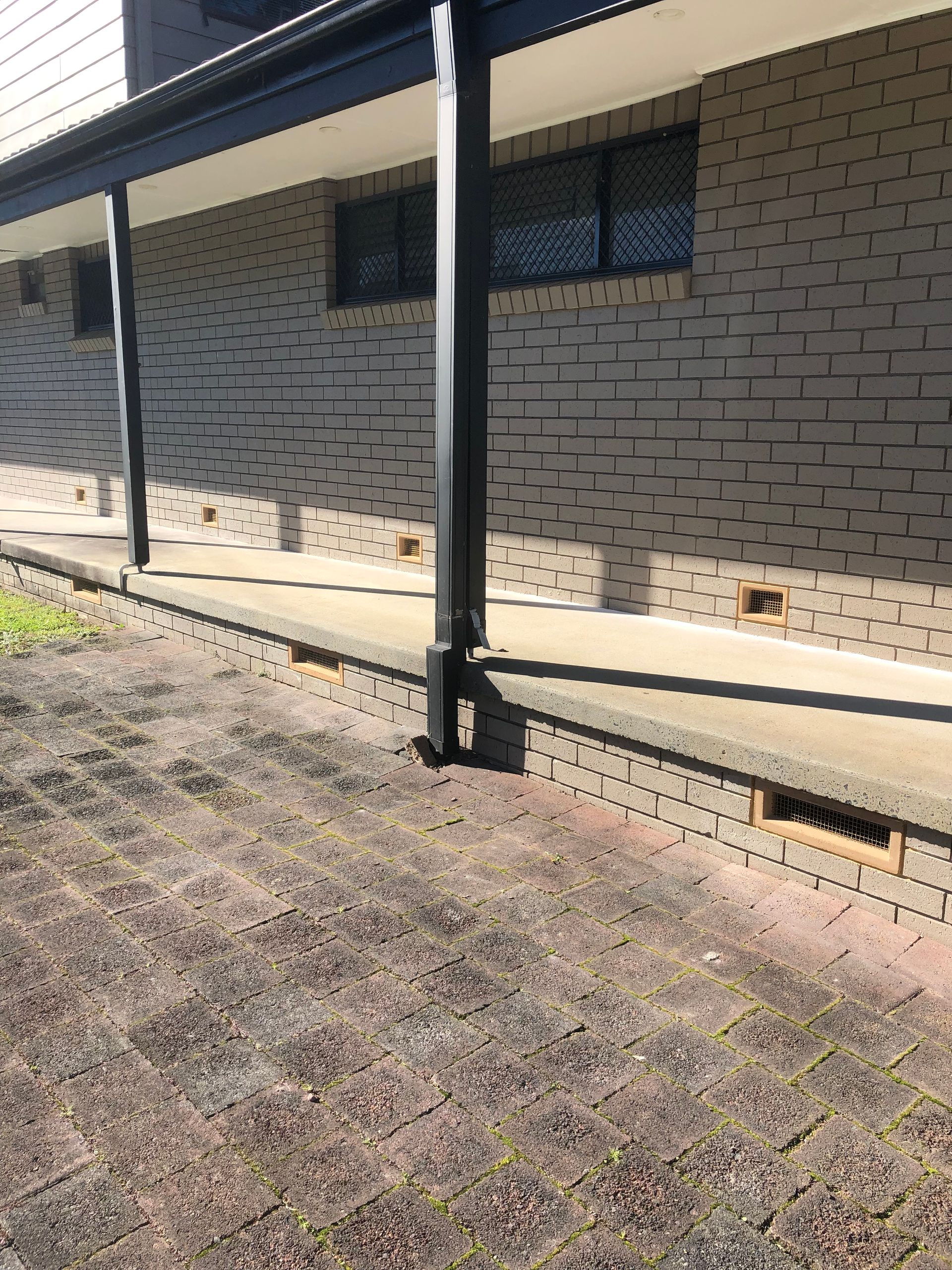 A Brick Wall And Brick Subfloors With Ventialtion Windows — Heritage Bricklaying & Remedial Services In Jilliby, NSW