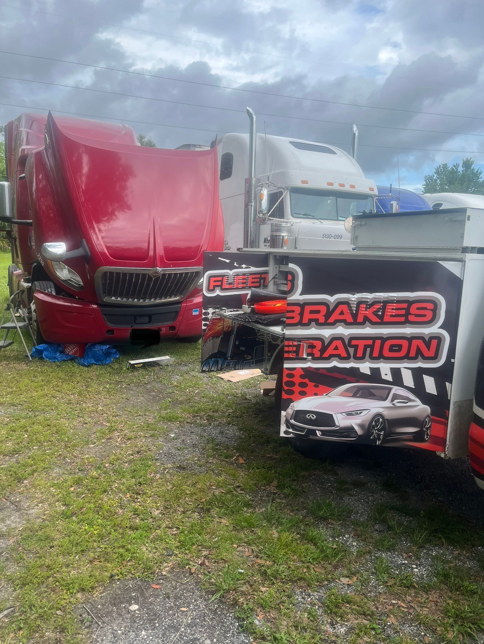A truck is parked next to a truck.