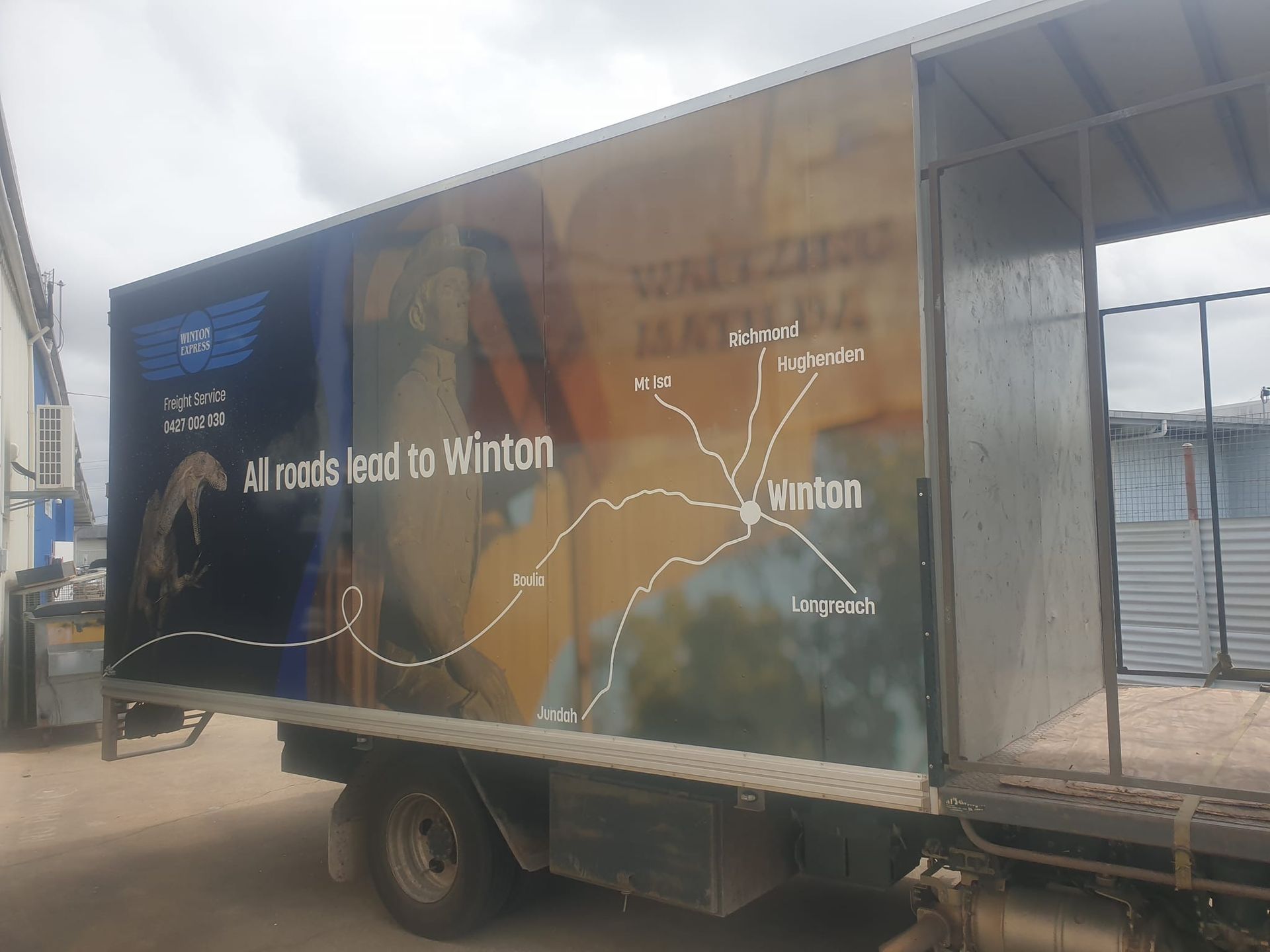 Truck side with a map showing roads leading to Winton, Australia.