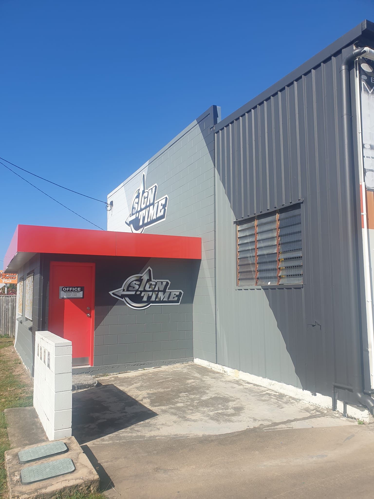 Building exterior with red door and 
