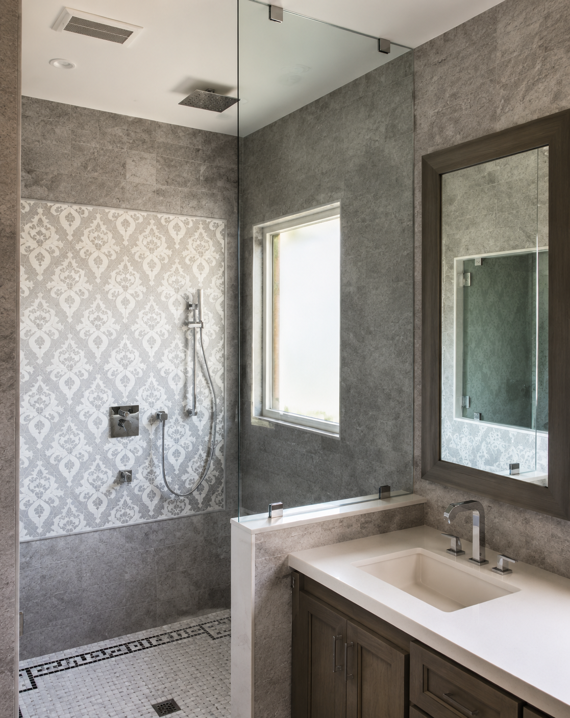Modern bathroom with walk-in shower, large mirror, white vanity, and gray textured walls