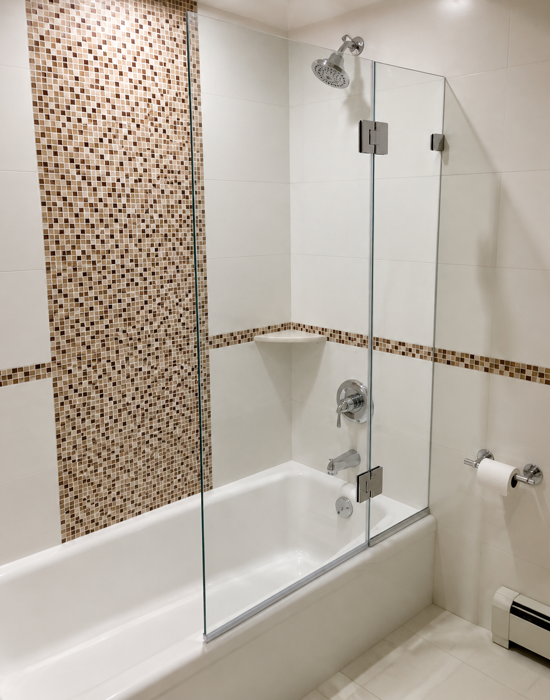 Bathroom with a tub-shower combo, glass shower panel, mosaic tile accents, and grab bar.