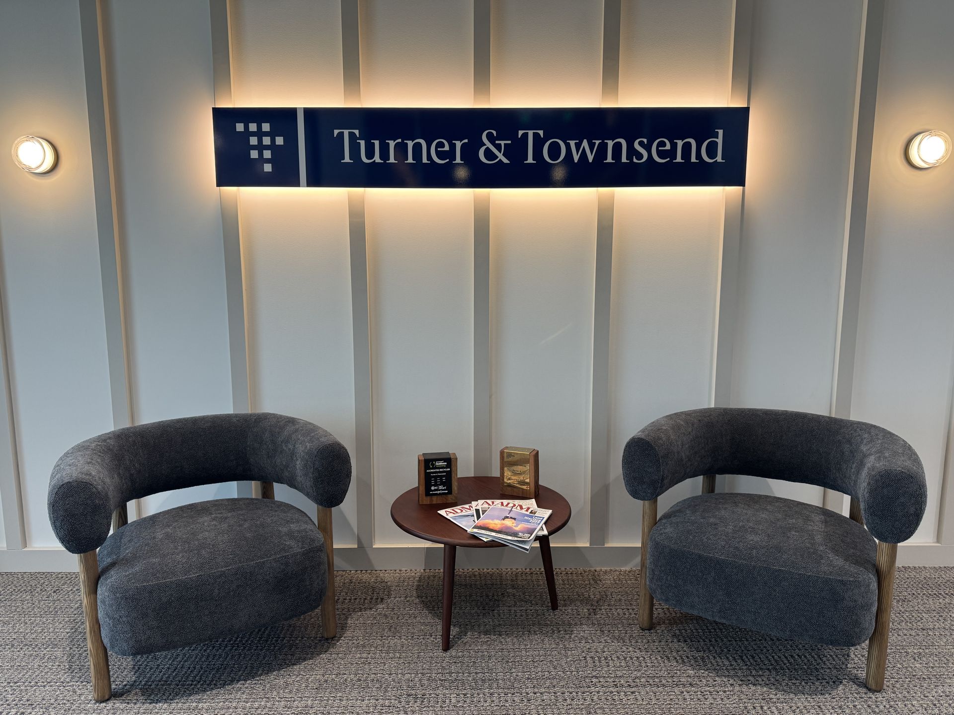 Two Grey Armchairs Face a Small Table with Magazines — Capital Signs in Fyshwick, ACT