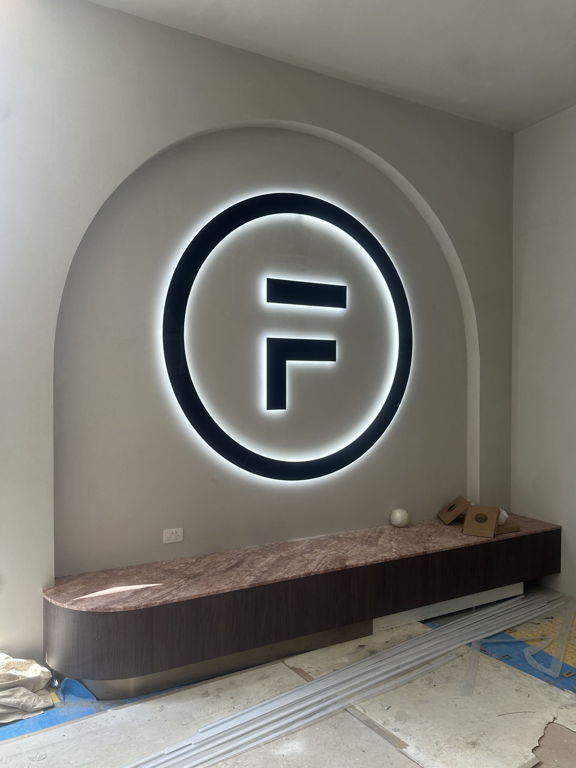 Large, illuminated logo with an