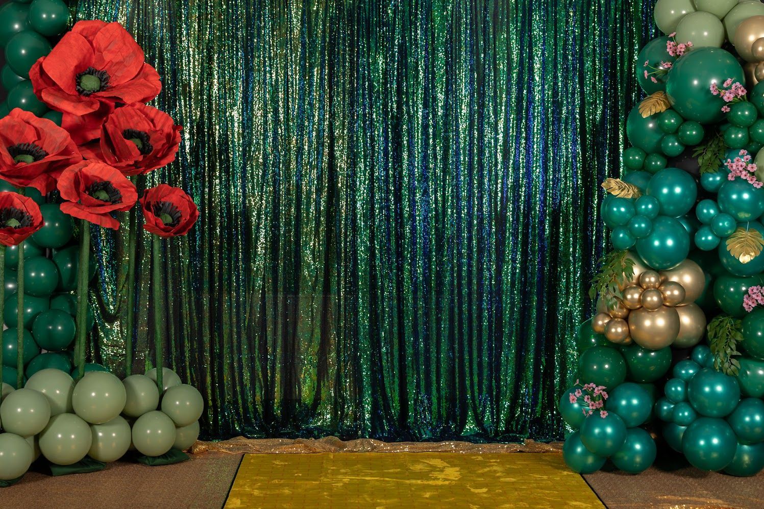 Custom themed organic balloon installation with specialty backdrop accents for event decor in San Antonio and South Texas
