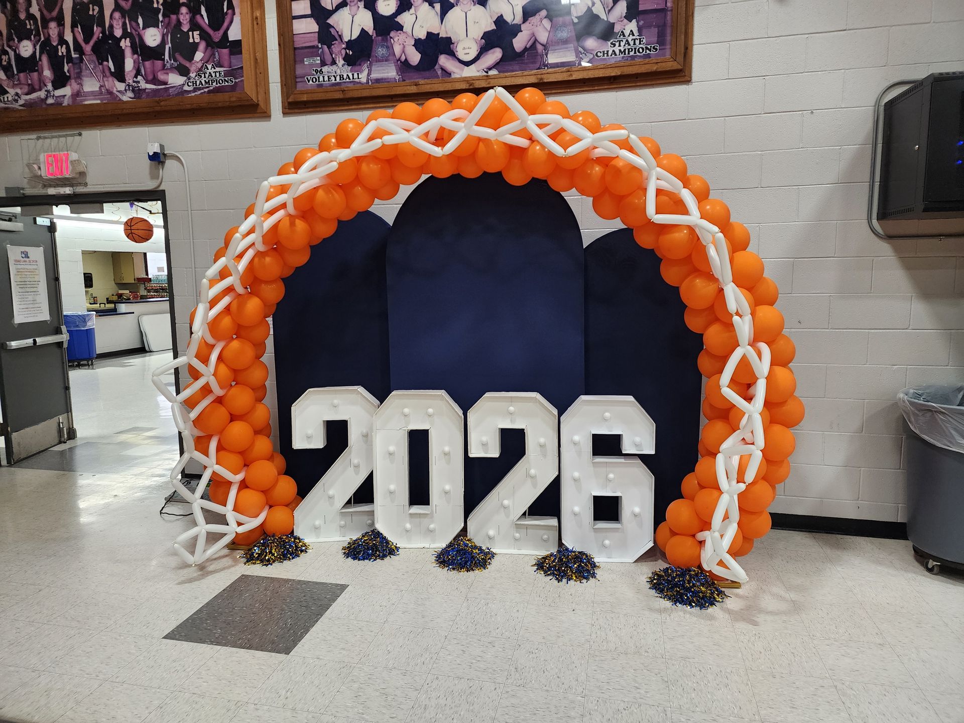 Custom orange balloon basketball hoop arch rental for sports banquet event decor in San Antonio and South Texas